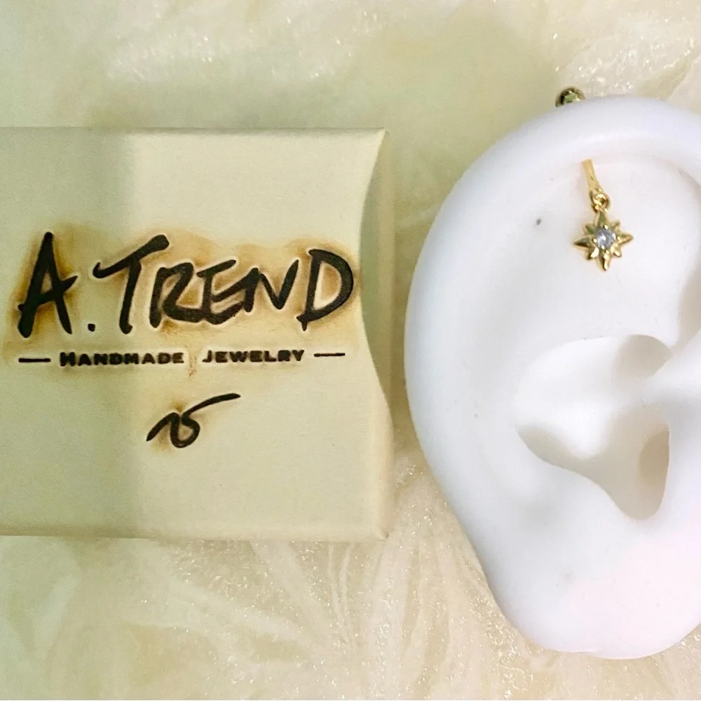 Gold Starburst Drop vertical cartilage Earring